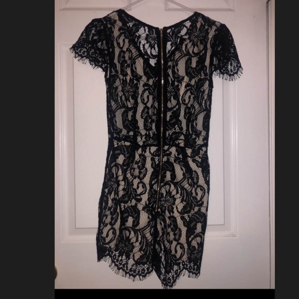 Black Lacey romper nude underneath.